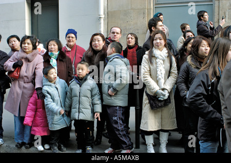 Paris France, Diverse Crowd, Families, Celebrating Chinese New Year, Community Celebrating, Audience watching Parade on Street, multigenerational Stock Photo