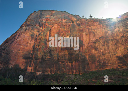Early Sunset. The sun sets early deep in the red rock canyons of the Zion National Park Stock Photo