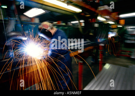 A welder at work in a factory. Stock Photo