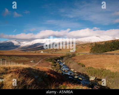 AFON LLUGWY in the Ogwen Valley with snow on the Carnedd mountains Capel Curig Conwy North Wales UK Stock Photo