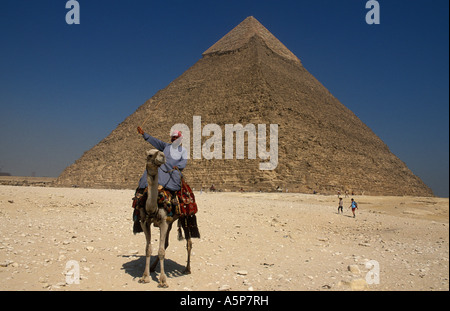 camel rider in front of Pyramid of Khafre with limestone covering at the summit, Pyramids of Giza, Cairo, Egypt Stock Photo