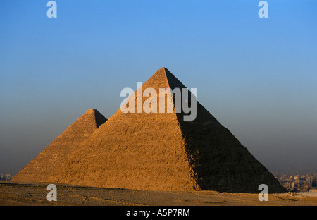 Pyramid of Khafre with limestone covering at the summit in front of Pyramid of Khufu, Pyramids of Giza, Cairo, Egypt Stock Photo