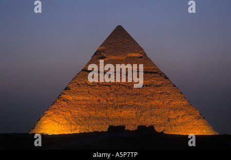 Pyramid of Khafre with limestone covering at the summit lit up at night, Pyramids of Giza, Cairo, Egypt Stock Photo