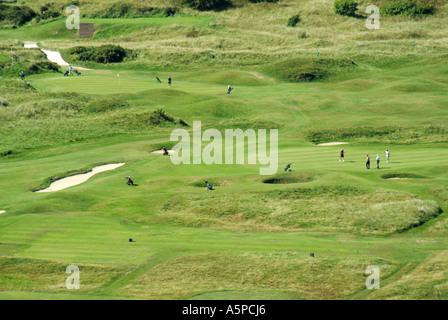 Golfers on Harlech golf course seen from the castle Gwynedd North Wales UK Stock Photo