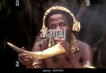 Zulu man smoking a pipe Damazulu Kraal Kwa Zulu Natal South Africa Stock Photo