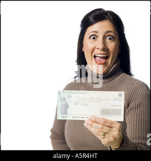 Woman holding cheque from US Treasury Prototype Stock Photo - Alamy