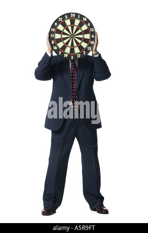 Man with dartboard hiding face Stock Photo