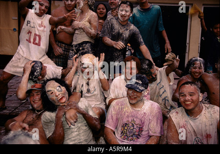 PERU:CELEBRATING NEW YEARS EVE IN THE TOWN OF LETICIA FLOUR AND WATER IS TRADITIONALLY THROWN TA PASSESRS BY, Peru,  2000 Stock Photo