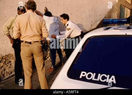 ILLEGAL IMMIGRANTS. POLICE SEARCHING WEST AFRICANS ON THE STREETS OF LAS PALMAS, CANARY ISLANDS Stock Photo