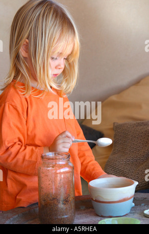 Three year old girl about to eat Stock Photo