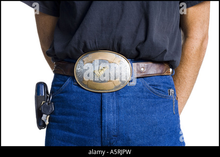 Midsection of slender young man wearing a big belt buckle Stock Photo