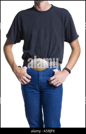 Midsection of slender young man wearing a big belt buckle Stock Photo