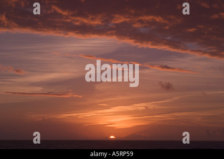 Sunrise or sunset in cloudy sky Stock Photo