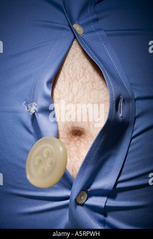 Close up of fat stomach bursting through shirt Stock Photo - Alamy