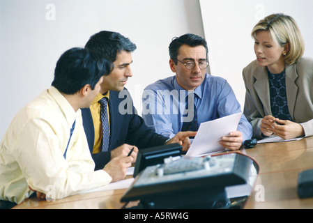 Business colleagues studying document Stock Photo