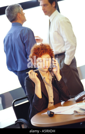Businesswoman using phone Stock Photo