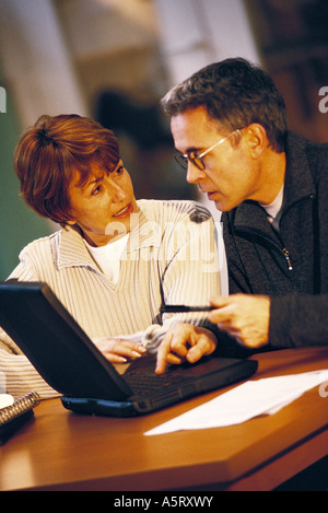 Senior couple using laptop Stock Photo
