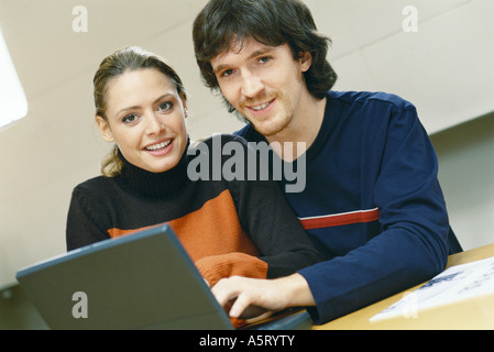 Couple using laptop Stock Photo