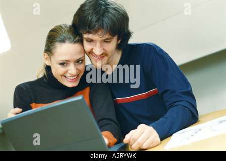 Couple using laptop Stock Photo