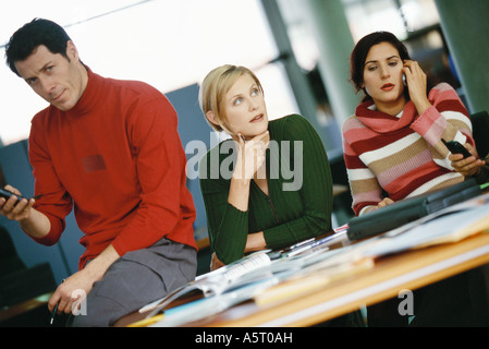 Colleagues sitting around table Stock Photo