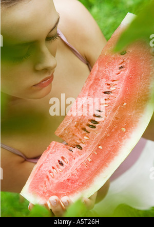 Woman holding slice of watermelon Stock Photo