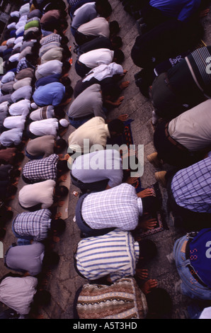 Muslim men bow in prayer at the old city East Jerusalem Israel Stock Photo