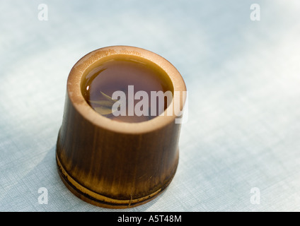 Bamboo cup of tea Stock Photo