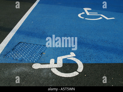 Handicapped symbols on asphalt Stock Photo