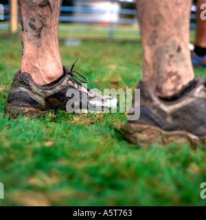 Man wearing dirty running shoes after the 'Man v Horse' race in Llanwrtyd Wells, Wales UK  KATHY DEWITT Stock Photo