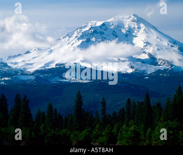 Snow and glacier covered Mount Shasta looms over the Northern California landscape and can be seen for miles in all directions Stock Photo