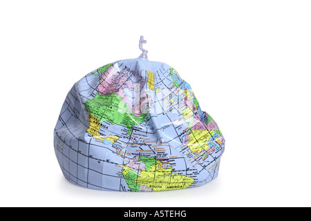 Deflated Earth Globe cut out on white background Stock Photo