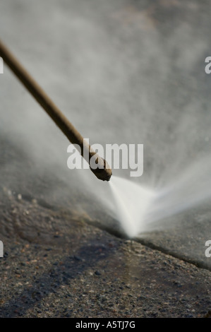 Gum removal from street by steam pressure. Picture by Jim Holden. Stock Photo