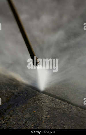 Gum removal from street by steam pressure. Picture by Jim Holden. Stock Photo