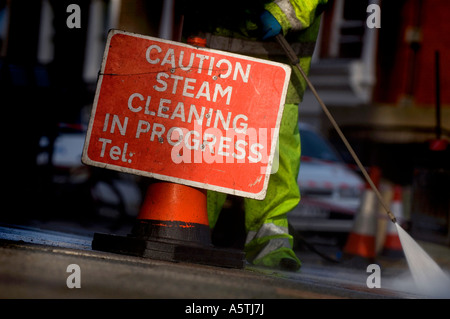 Gum removal from street by steam pressure. Picture by Jim Holden. Stock Photo