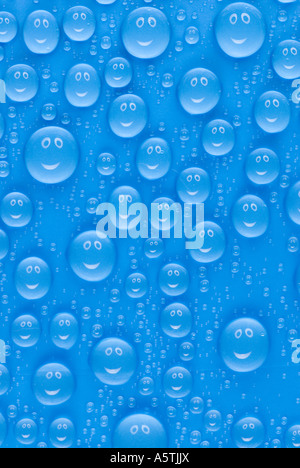 accumulation of many small blue water drops on a surface a smiling face reflecting in each of them Stock Photo