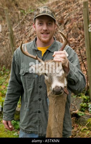 Hunter with eleven point buck deer he shot with a muzzle loader Stock Photo