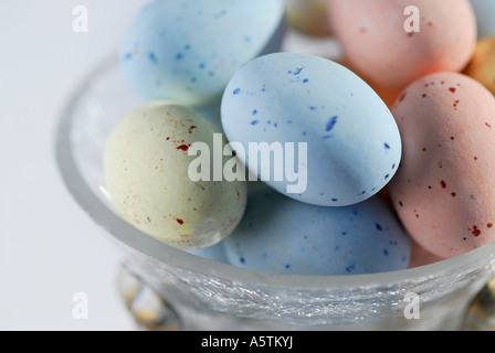 speckled easter eggs in glass bowl Stock Photo