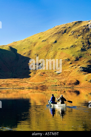 Two People Canoeists on Crummock Water, Lake District National Park, Cumbria, England, UK Stock Photo