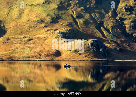 Two Men in a Canoe, Canoeists on Crummock Water, Lake District National Park, Cumbria, England, UK Stock Photo