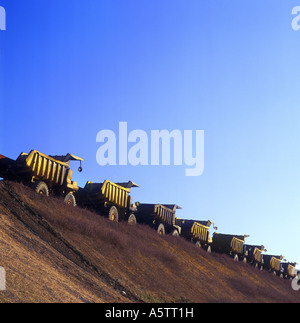 Line Of Dump Trucks By Highway Under Construction, Pennsylvania, USA Stock Photo