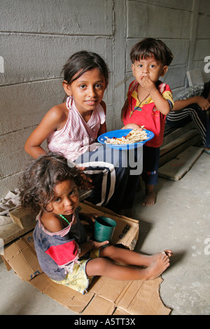 Painet jj1666 honduras children kids boy girls free feeding program slum barrio chamelecon san pedro sula latin america Stock Photo