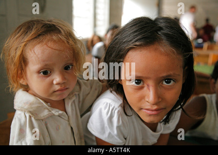 Painet jj1671 honduras children kids girls free feeding program slum barrio chamelecon san pedro sula latin america central Stock Photo