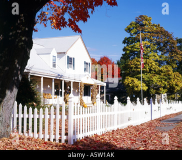 traditional white clapboard house surrounded by autumn foliage concord massachusetts usa Stock Photo