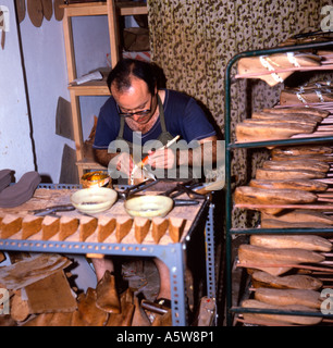 Cobbler in a back street workshop on the island of Rhodes - Greece Stock Photo