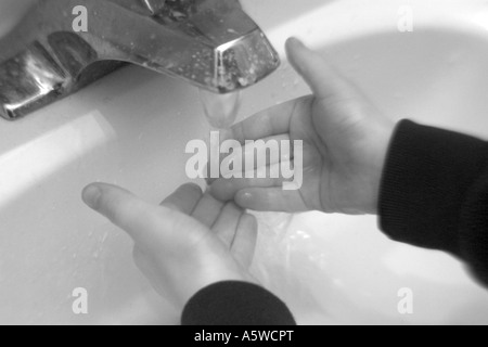 Child washing hands Stock Photo
