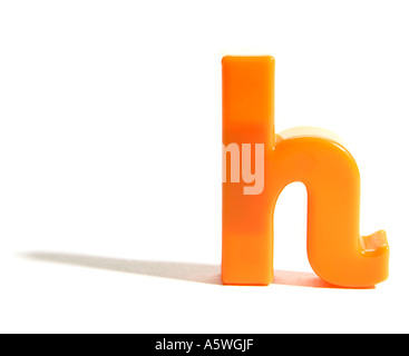 an orange fridge magnet letter h Stock Photo