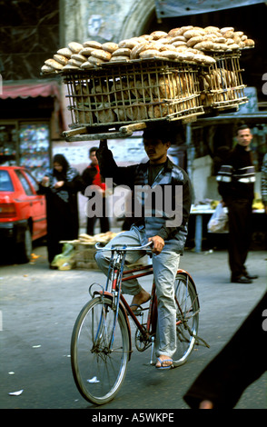 CAIRO, Egypt - Men transport bread from a factory to a shop in Cairo on ...
