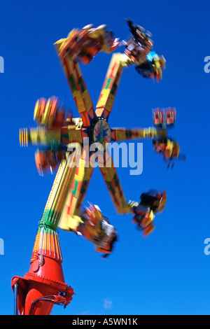 Fast moving ride at a carnival amusement park Stock Photo - Alamy