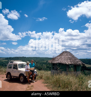 Couple on safari looking at a map at Elephant Lookout  in Shimba Hills National Reserve, near Mombasa, Kenya, East Africa Stock Photo