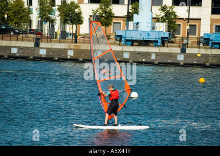 Student learning to windsurf at the Salford Watersports Centre, Ontario Basin, Salford Quays, Greater Manchester, UK Stock Photo